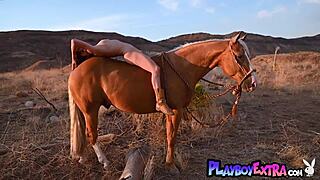 Petite redhead Odette Fox bares big natural tits pussy on horse