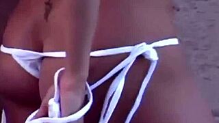 mandy teases the camera with her playful striptease routine