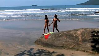 Young lesbians lick and toy tight shaved pussies seaside