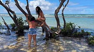 two sexy brazilian brunettes kiss on cabo beach publicly