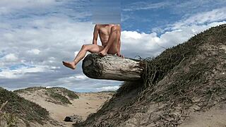 Athletic babe poses nude teases cock intensely at beach cums in plaza