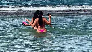 two sexy brazilian brunettes kiss on cabo beach publicly