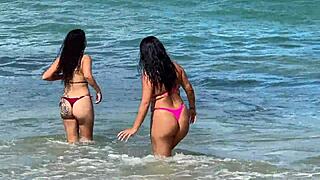 two sexy brazilian brunettes kiss on cabo beach publicly