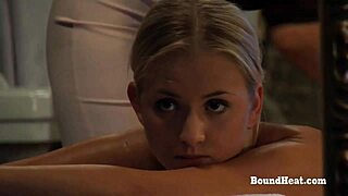 Handcuffed blonde maid gets nude domination massage