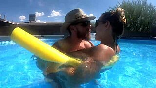 Pregnant milf swims and chats poolside with neighbors
