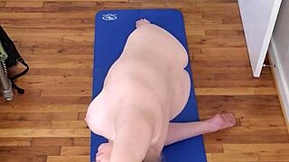 Mature beauty stretches in naked morning yoga routine