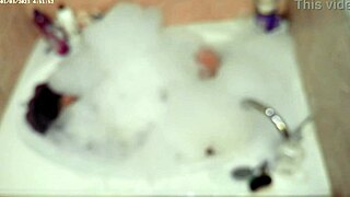 solo boy bubbles up naked in bath
