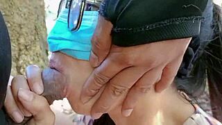 a young couple shares a tasty blowjob amid forest greenery