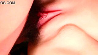 Close-up exploration of a beautiful woman's moist shaved pussy and wet vagina