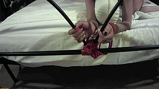 She's bound tight on bed front cam captures master's brutal pussy pounding