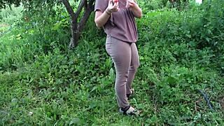 mature milf pisses shaved pussy in public garden jeans