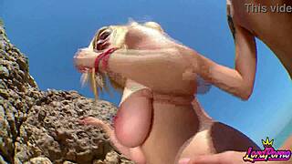 Blonde babe's big tits bounce wildly on beach doggy fuck 🌊