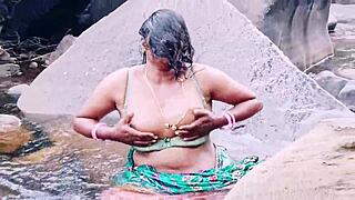VILLAGE AUNTY BATHES OUTDOOR WATERFALL DIRTY TELUGU TALKS!