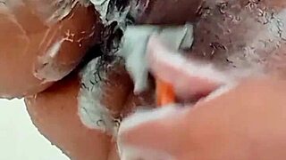 young brunette shaves her hairy pussy closeup in bathroom