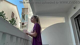 blonde beauty strips naked flashing big tits on balcony