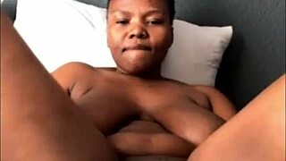 Ebony teen squirts from dildo play showing huge natural boobs