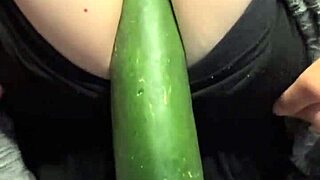 Milf stuffs cucumber deep in pussy for massive squirting explosion