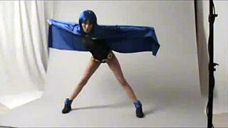 Amateur cosplayer embodies raven in outdoor public scene