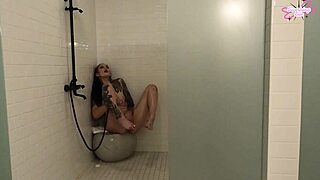 he strokes his throbbing cock hard in the homemade shower voyeur style shaking his big ass