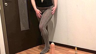 hey brunette beauty slips off pantyhose and enjoys huge dildo play on her ass