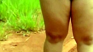 Pregnant Woman Stands Naked On Quiet Country Road