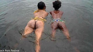 two skinny black lesbians bathe intimately in river