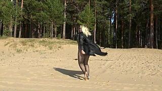 blonde walks confidently in fishnet bodystocking outfit