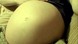 Pregnant woman enjoys intense solo belly play session