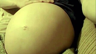 Pregnant woman enjoys intense solo belly play session