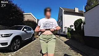 A milf with big saggy tits in the street