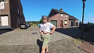 A milf with big saggy tits in the street