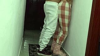 Woman grinding against wall rubbing and masturbating