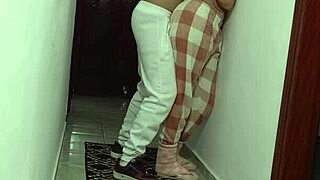 Woman grinding against wall rubbing and masturbating