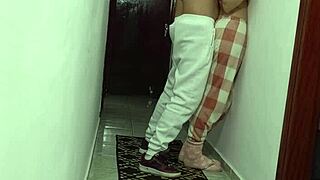 Woman grinding against wall rubbing and masturbating
