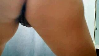 Young woman dances at home captured on her webcam