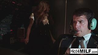 Flight attendant with big fake tits takes cock in the cockpit
